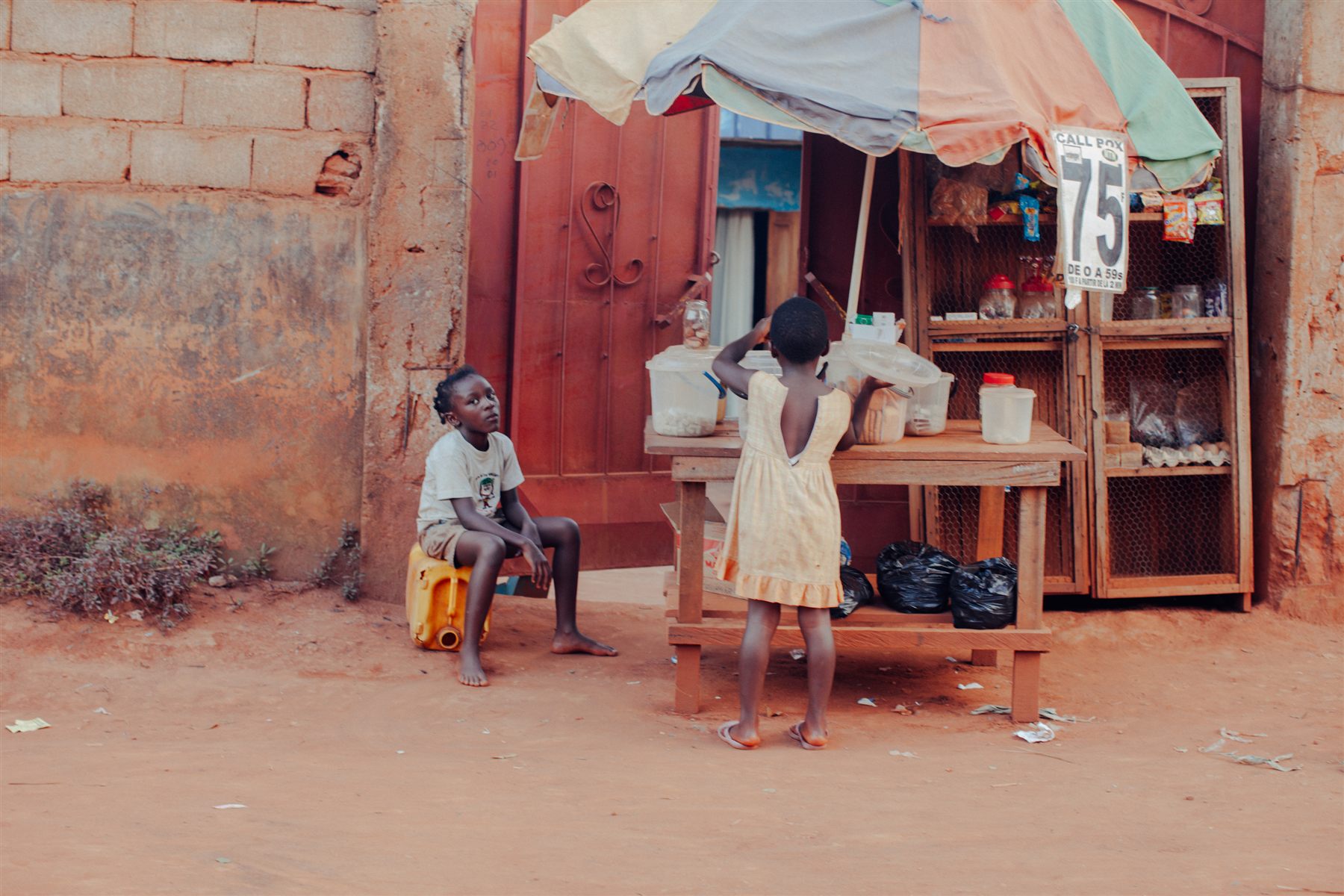 People standing beside a street stall