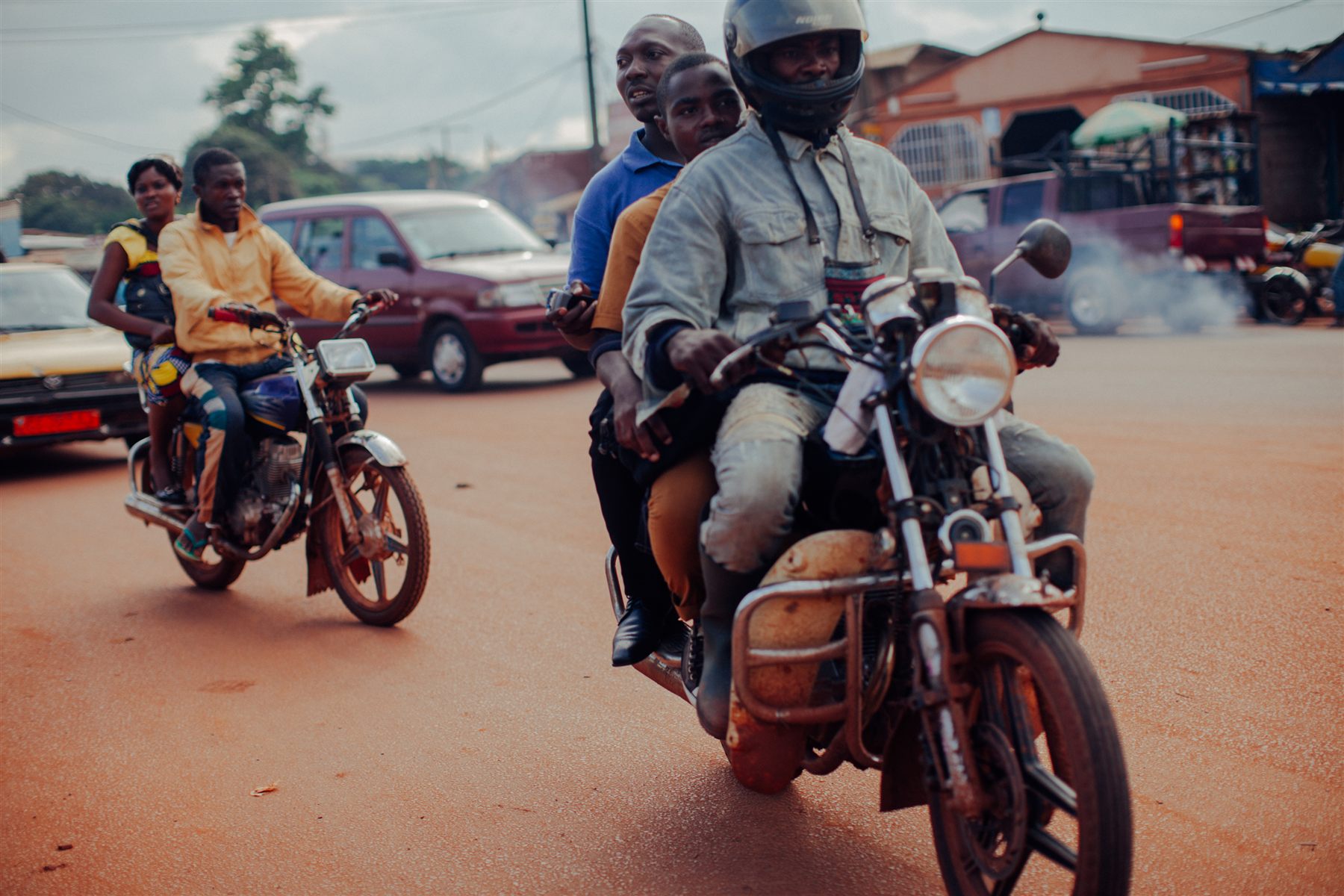 Two people riding a motorbike